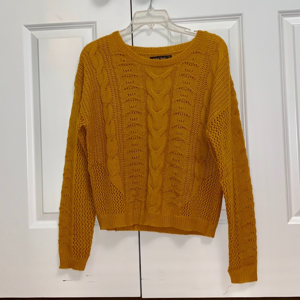 Yellow sweater.